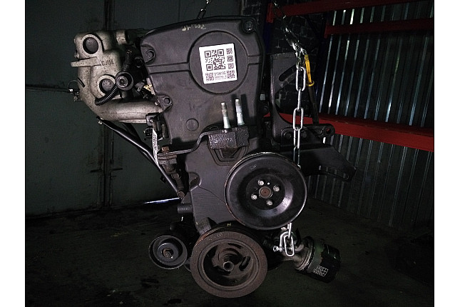Двигатель вид с боку KIA G4GC